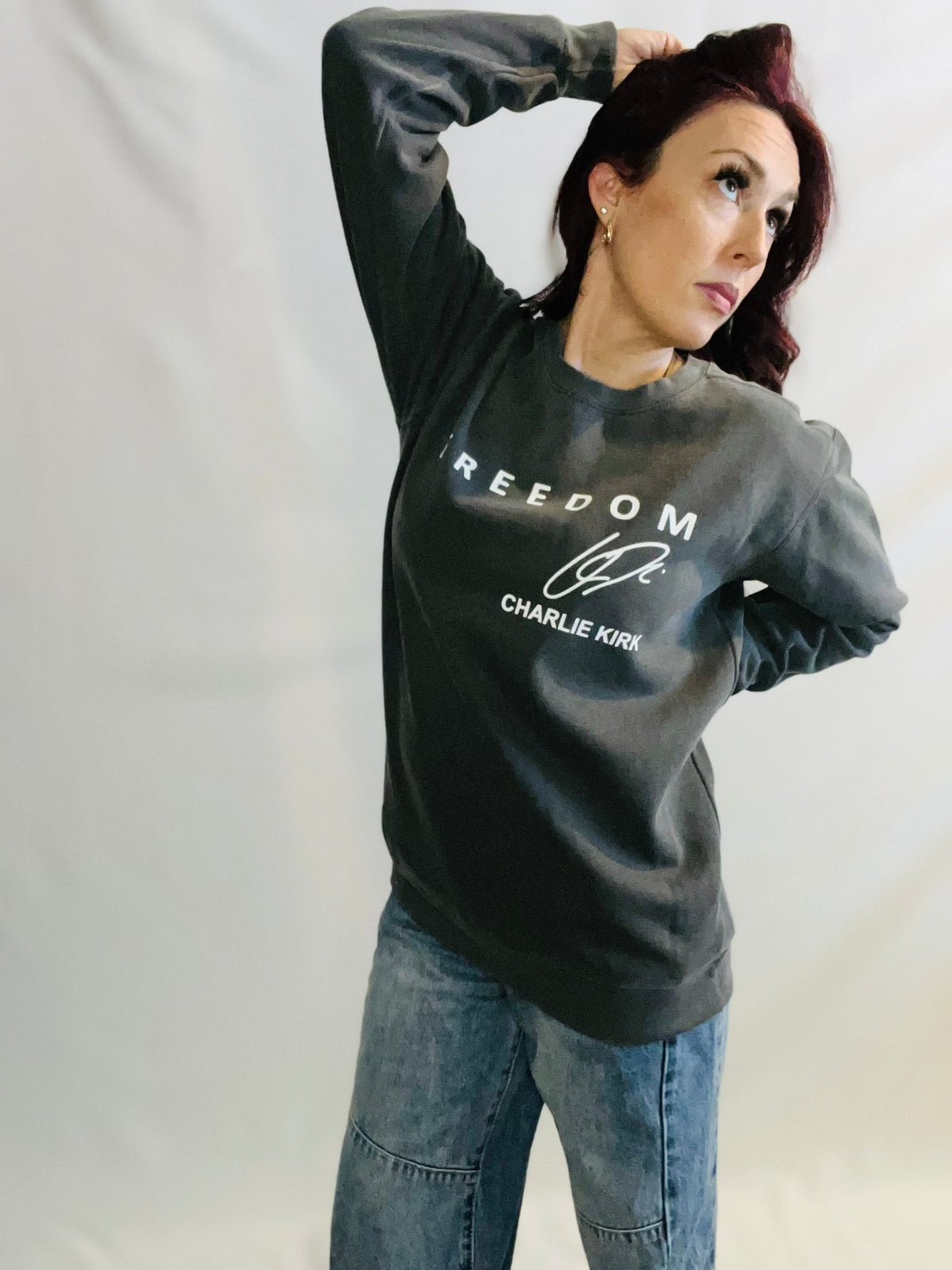 Vintage wash graphic crewneck sweatshirt with relaxed casual streetwear styling