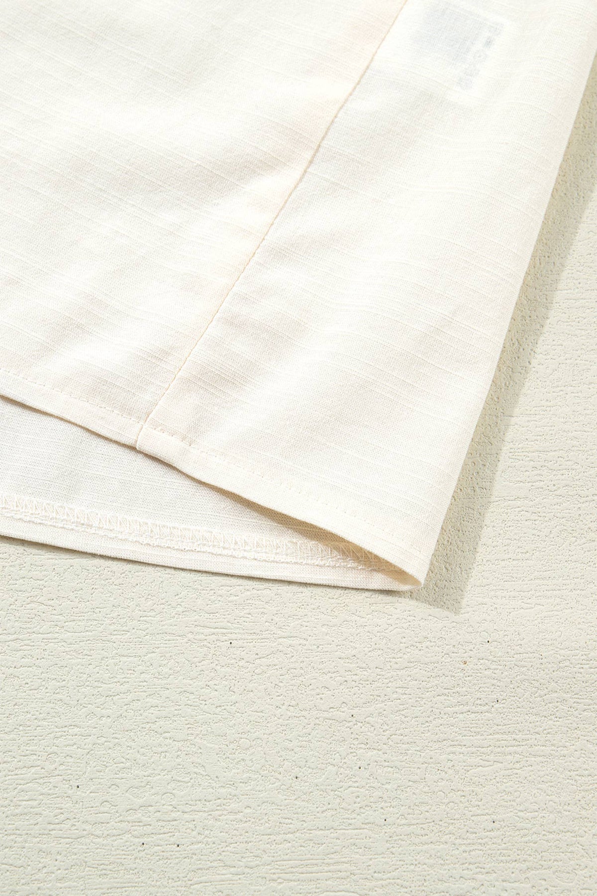 Close-up of beige fabric with a textured surface