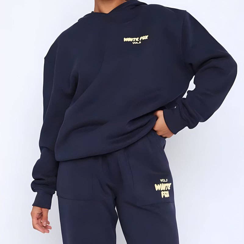 women wearing white fox sweater set in front of white backdrop