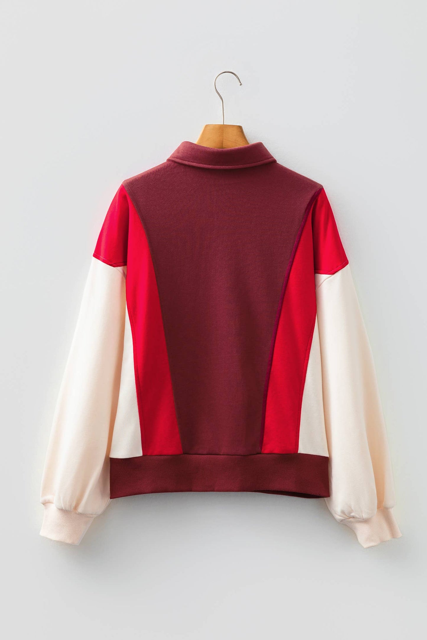 Oversized red color block Henley sweatshirt with relaxed casual streetwear styling