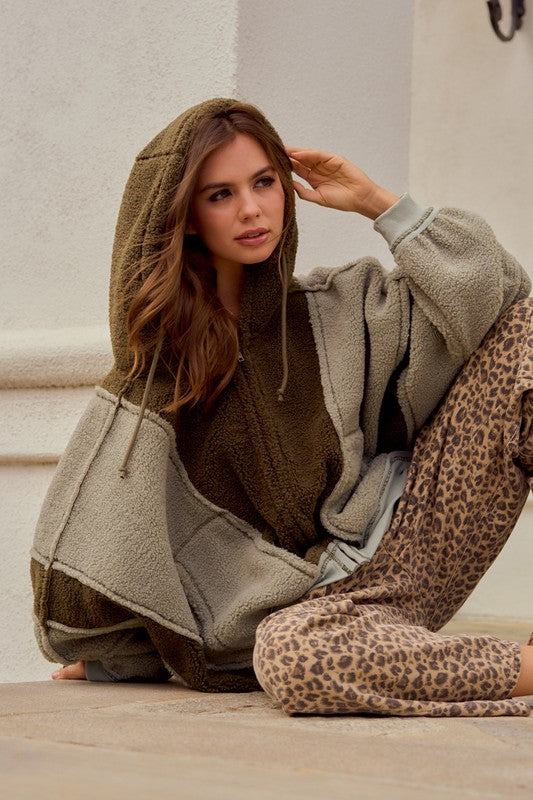 Leopard print wide leg cargo pants with relaxed streetwear styling and red drawstring detail