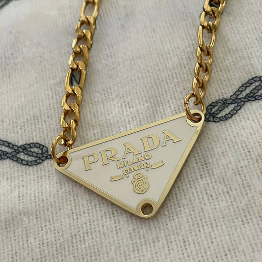 Repurposed white triangle pendant necklace with gold chain and luxury inspired minimalist styling