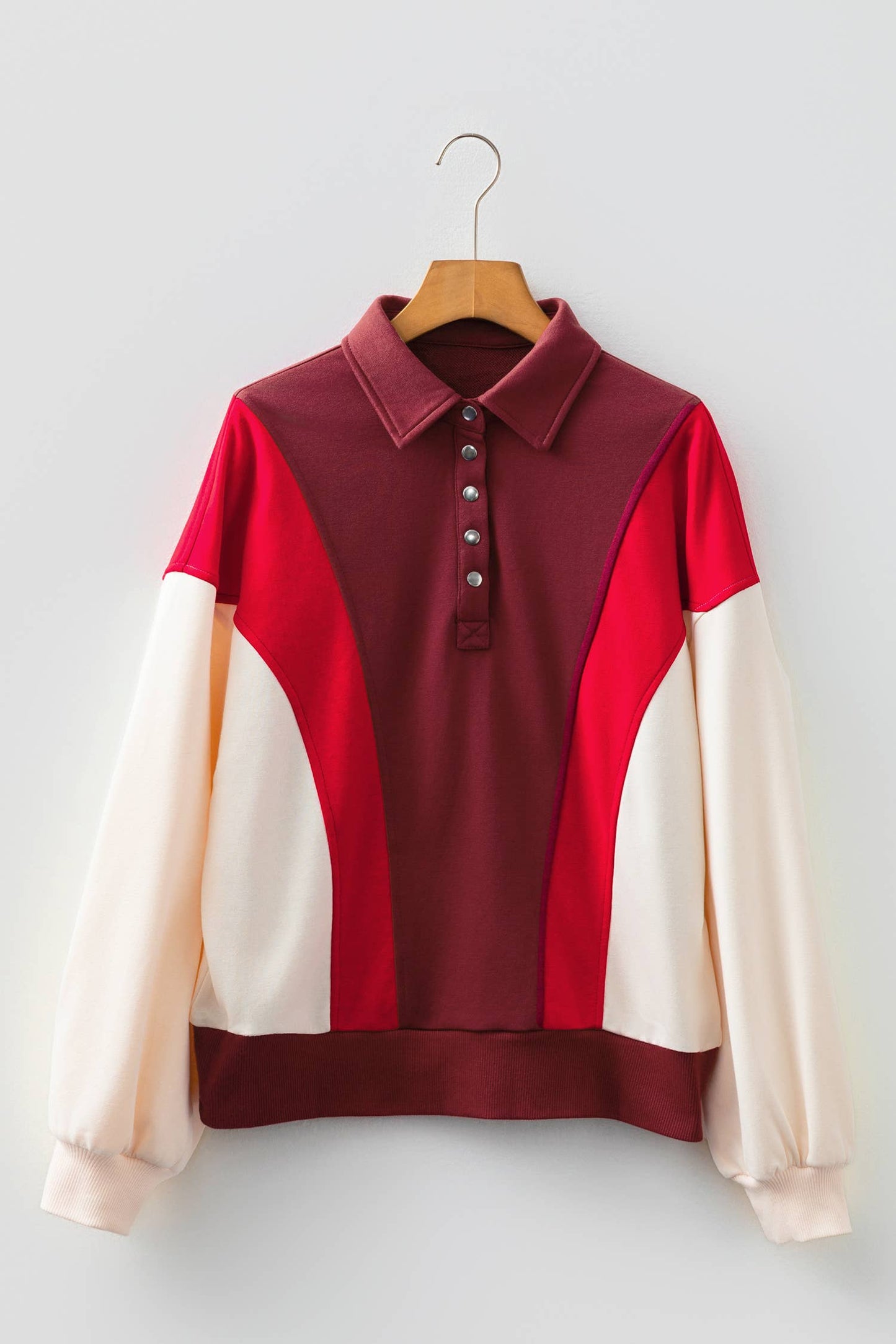 Oversized red color block Henley sweatshirt with relaxed casual streetwear styling