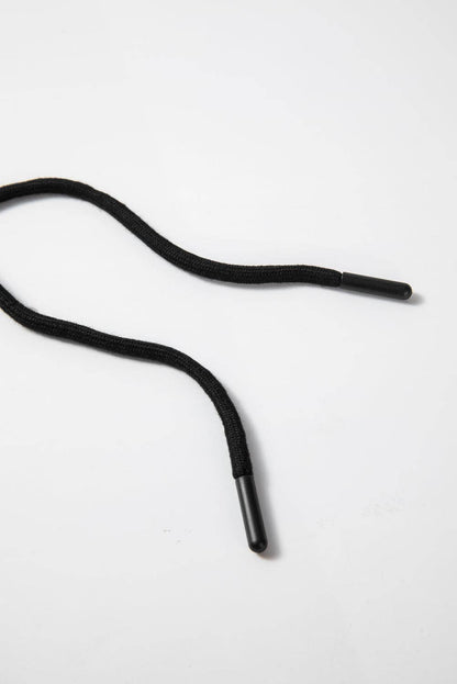 Black shoelace on a white background