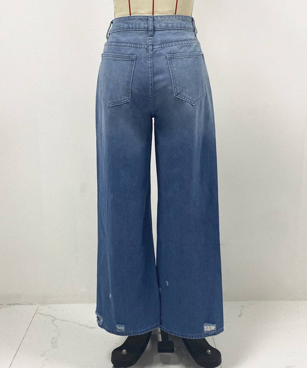 Wide-leg blue denim jeans shown from the back on a mannequin, featuring a high waist, straight legs, and distressed details near the hems.