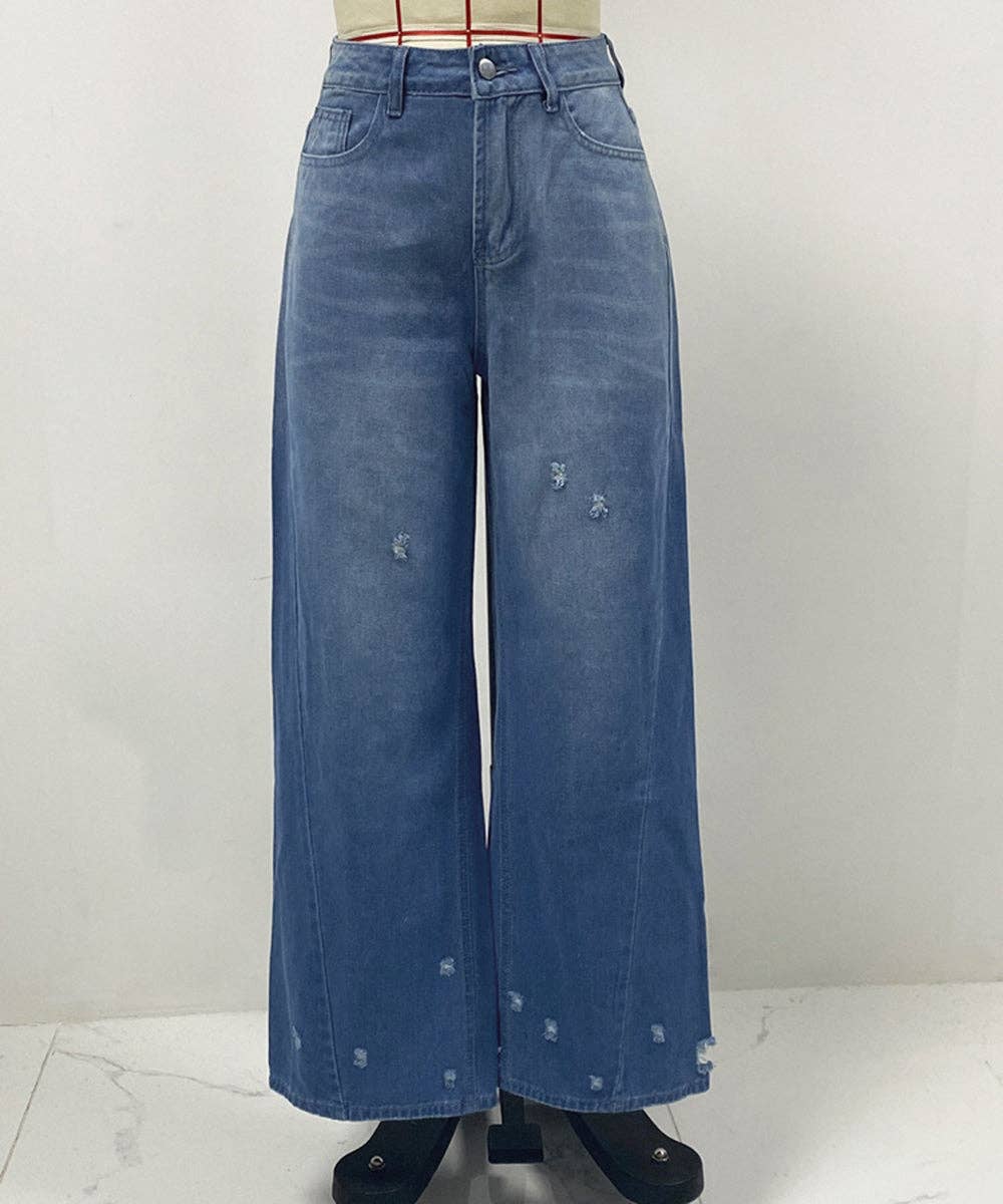 Wide-leg blue denim jeans with distressed details, shown on a mannequin against a plain light gray wall.