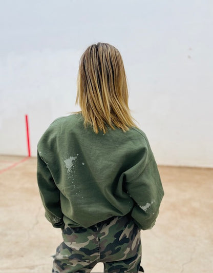 Olive green bleach wash oversized crewneck sweatshirt styled with camo pants