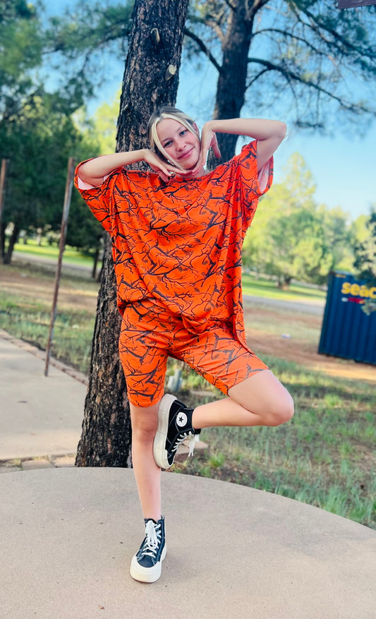 Orange camo oversized t-shirt and biker short matching set styled with sneakers