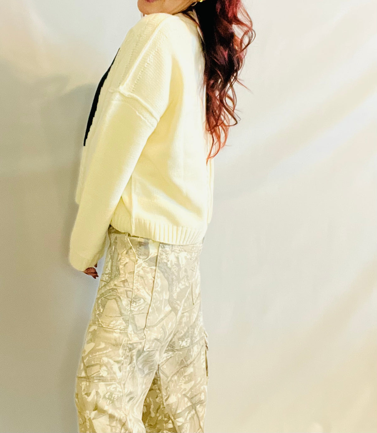 Cream oversized knit sweater with black 87 graphic and casual streetwear styling