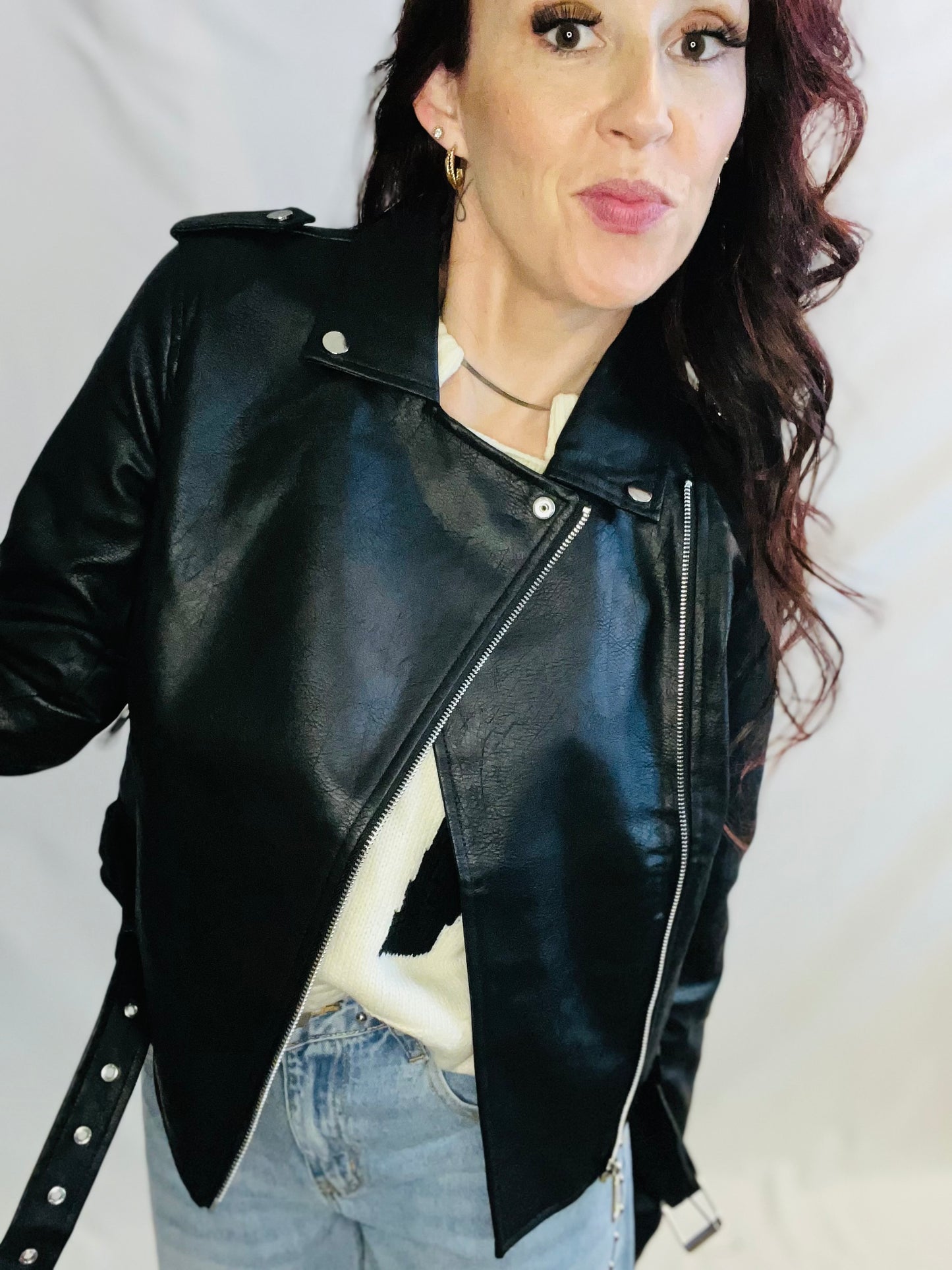 Black faux leather moto jacket with edgy minimalist streetwear styling for women