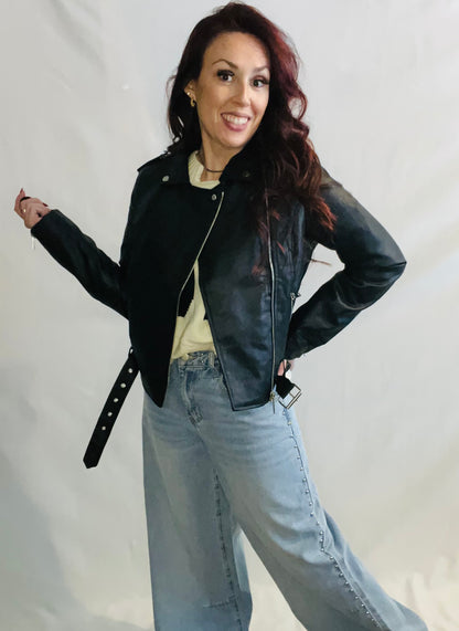 Black faux leather moto jacket with edgy minimalist streetwear styling for women