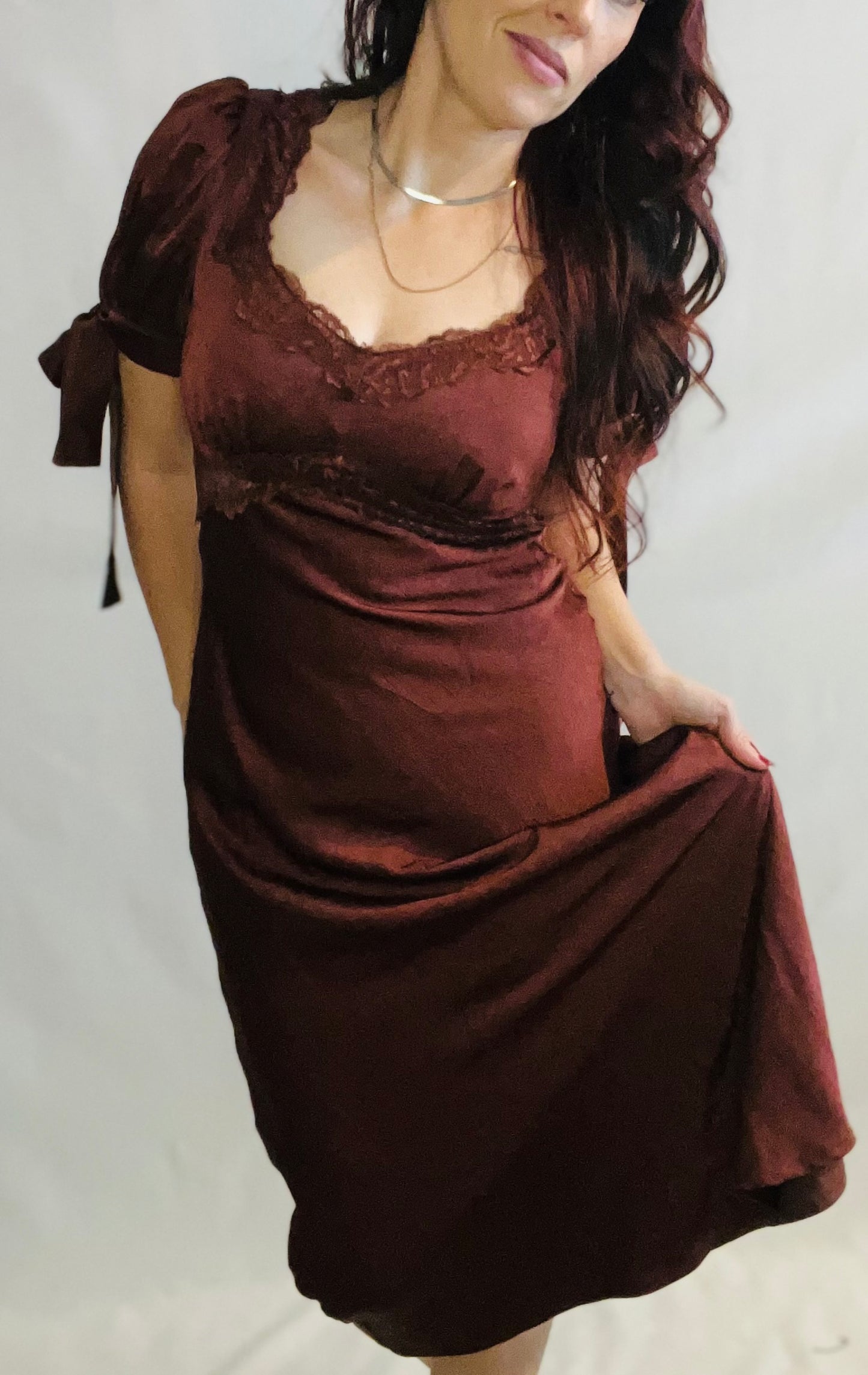 Chocolate brown satin midi dress with lace trim and feminine romantic styling