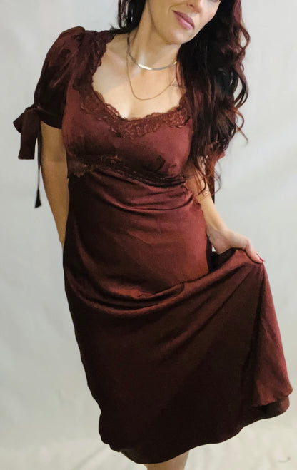 Chocolate brown satin midi dress with lace trim and feminine romantic styling