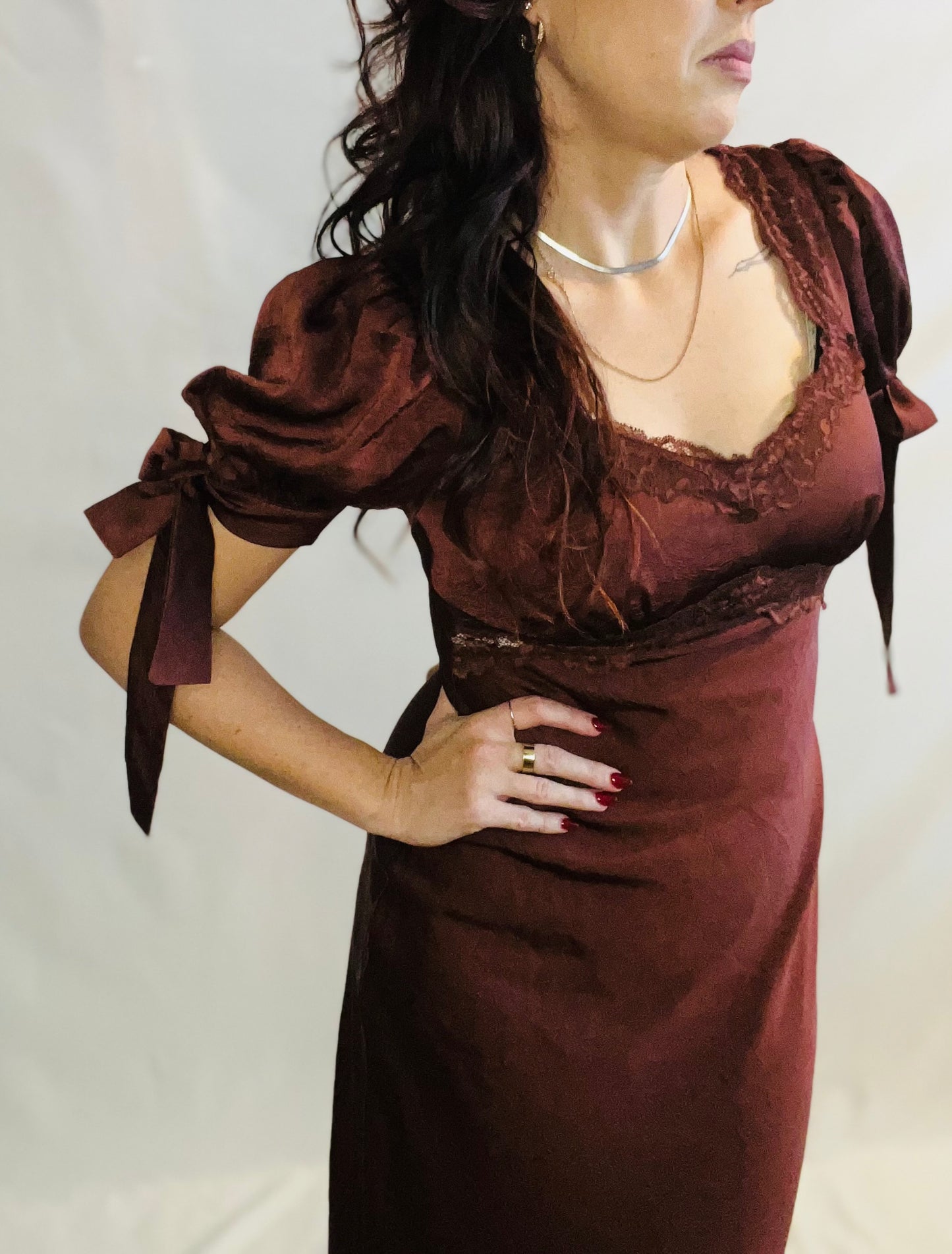 Chocolate brown satin midi dress with lace trim and feminine romantic styling