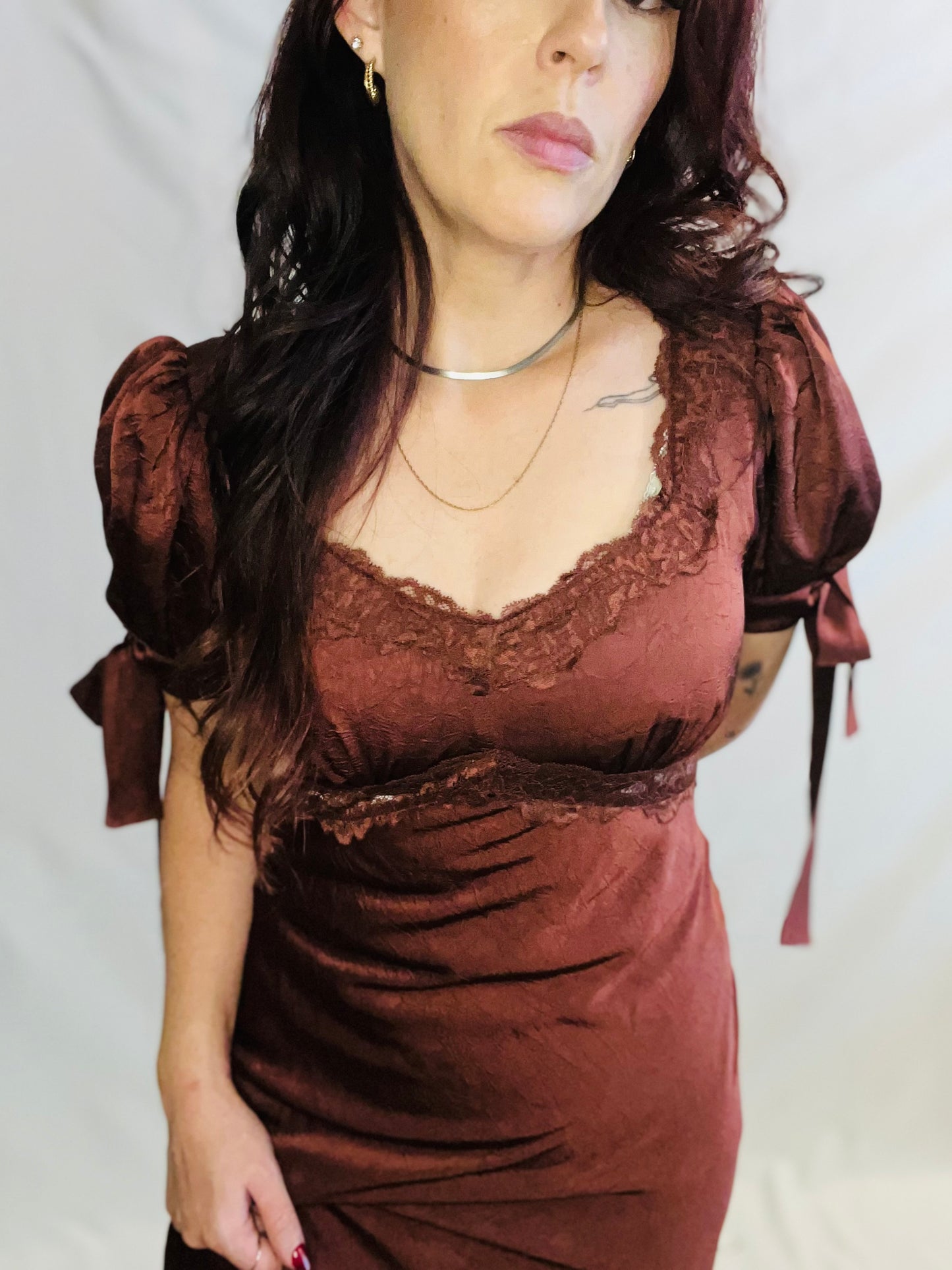 Chocolate brown satin midi dress with lace trim and feminine romantic styling