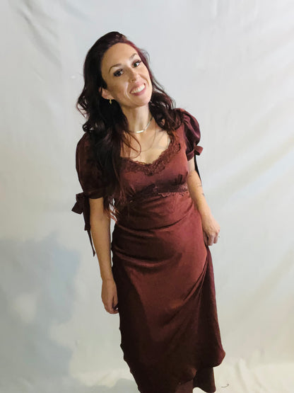 Chocolate brown satin midi dress with lace trim and feminine romantic styling