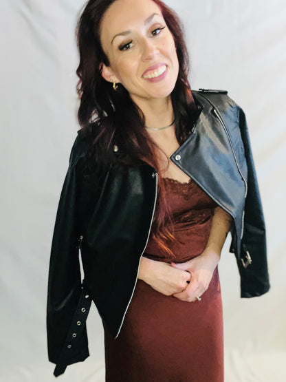 Black faux leather moto jacket with edgy minimalist streetwear styling for women