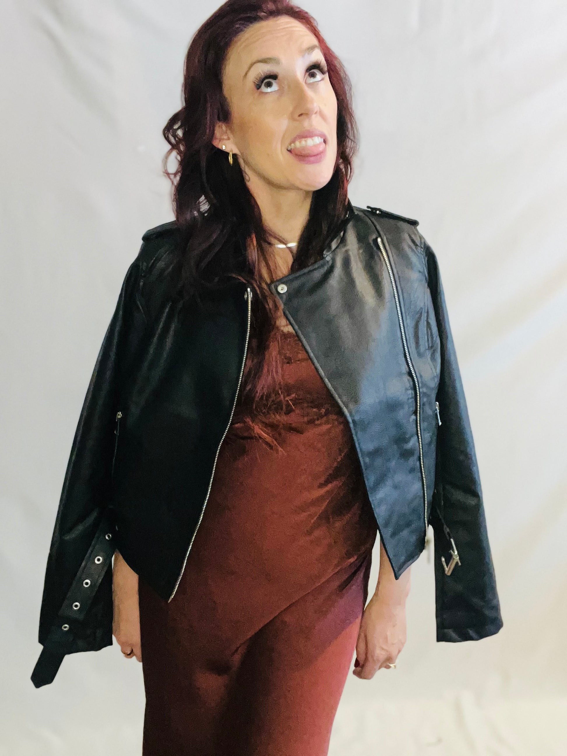 Black faux leather moto jacket with edgy minimalist streetwear styling for women