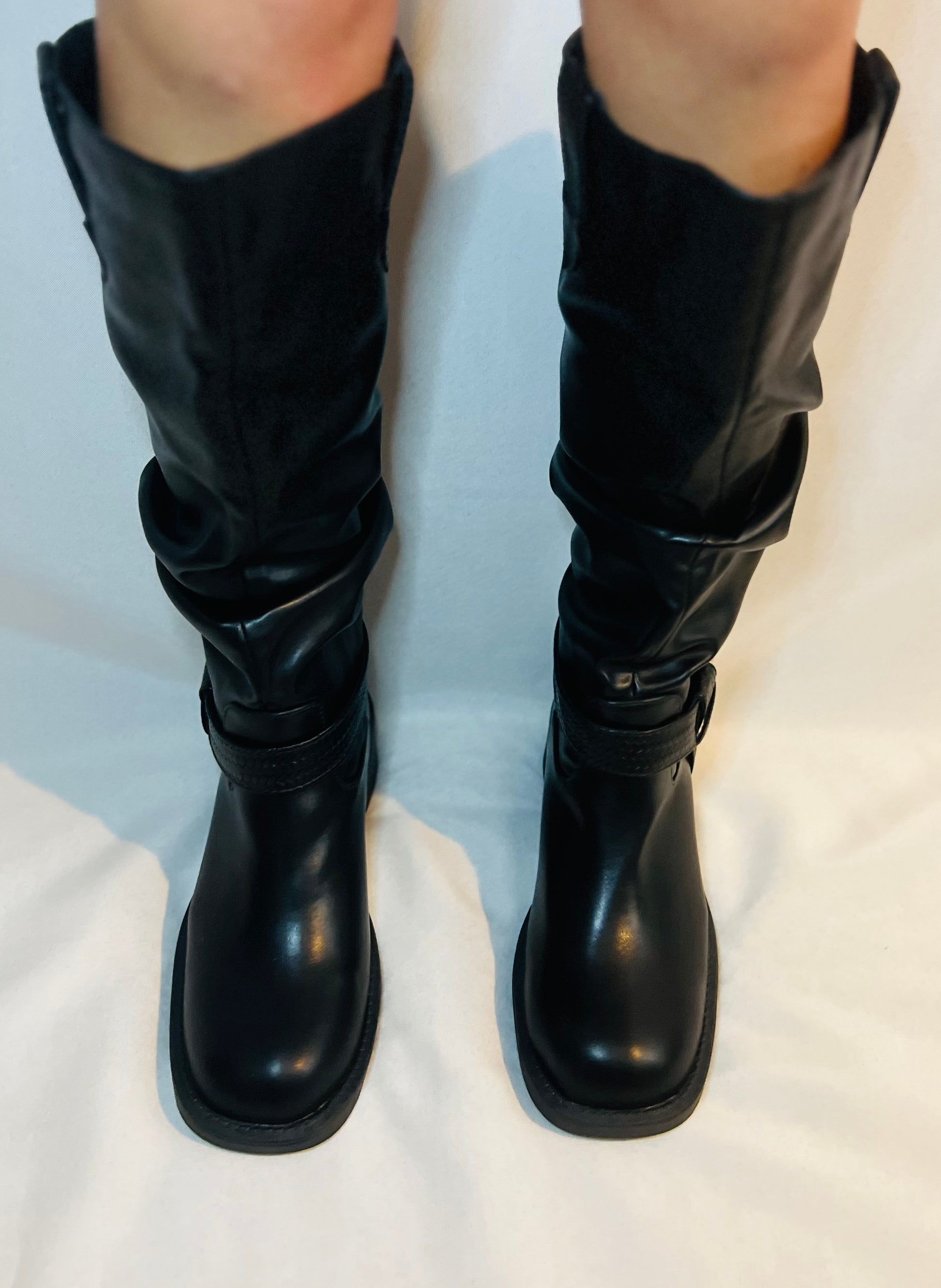 Black slouchy moto boots with chunky heel and edgy modern grunge streetwear styling