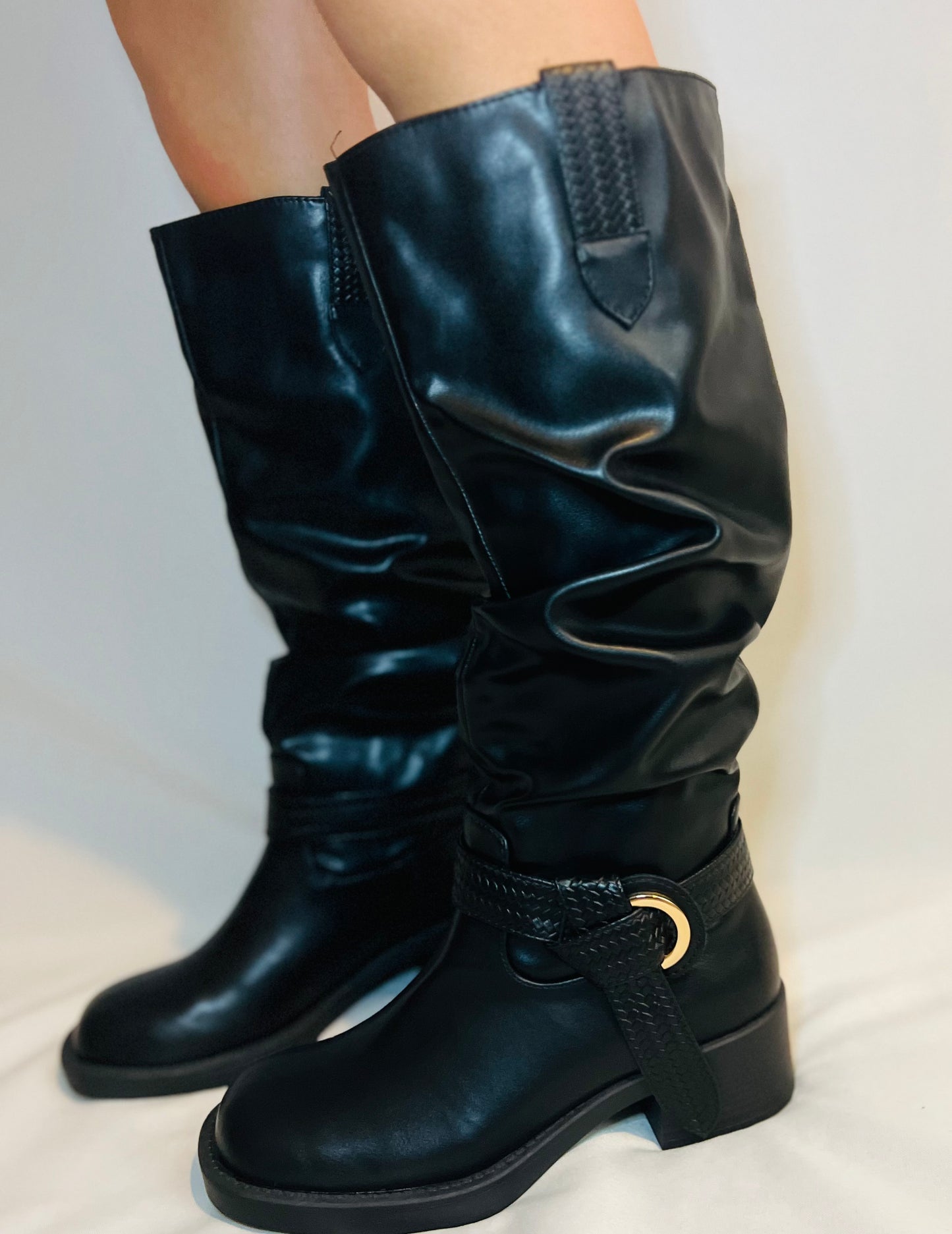 Black slouchy moto boots with chunky heel and edgy modern grunge streetwear styling