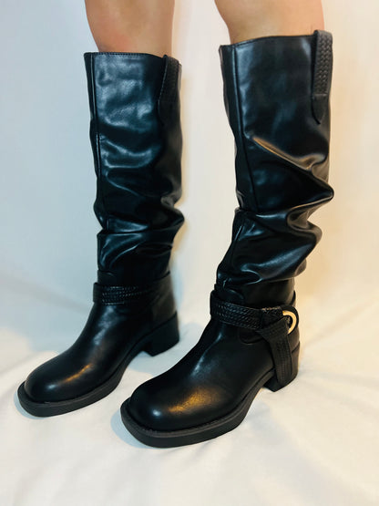 Black slouchy moto boots with chunky heel and edgy modern grunge streetwear styling