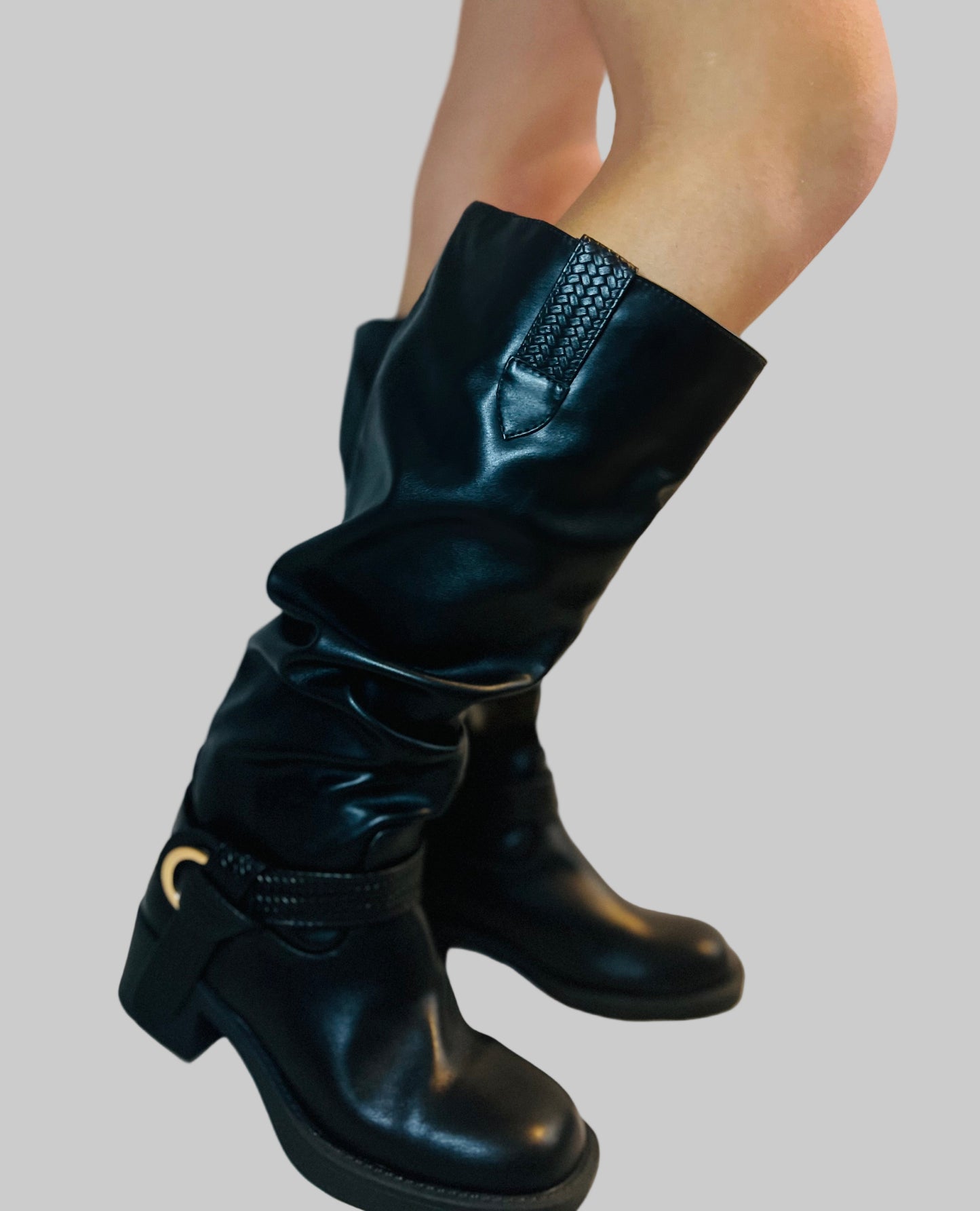 Black slouchy moto boots with chunky heel and edgy modern grunge streetwear styling