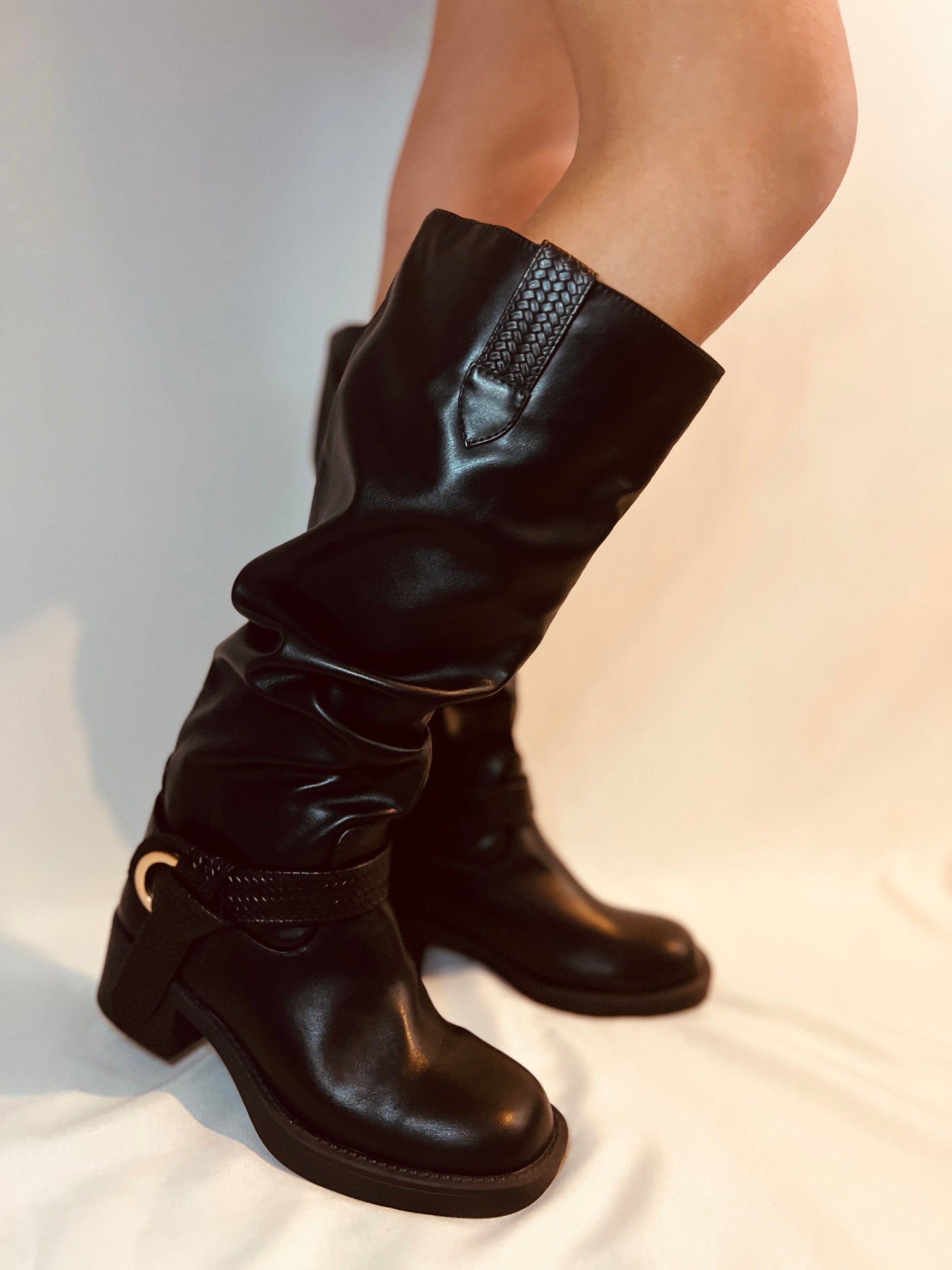 Black slouchy moto boots with chunky heel and edgy modern grunge streetwear styling
