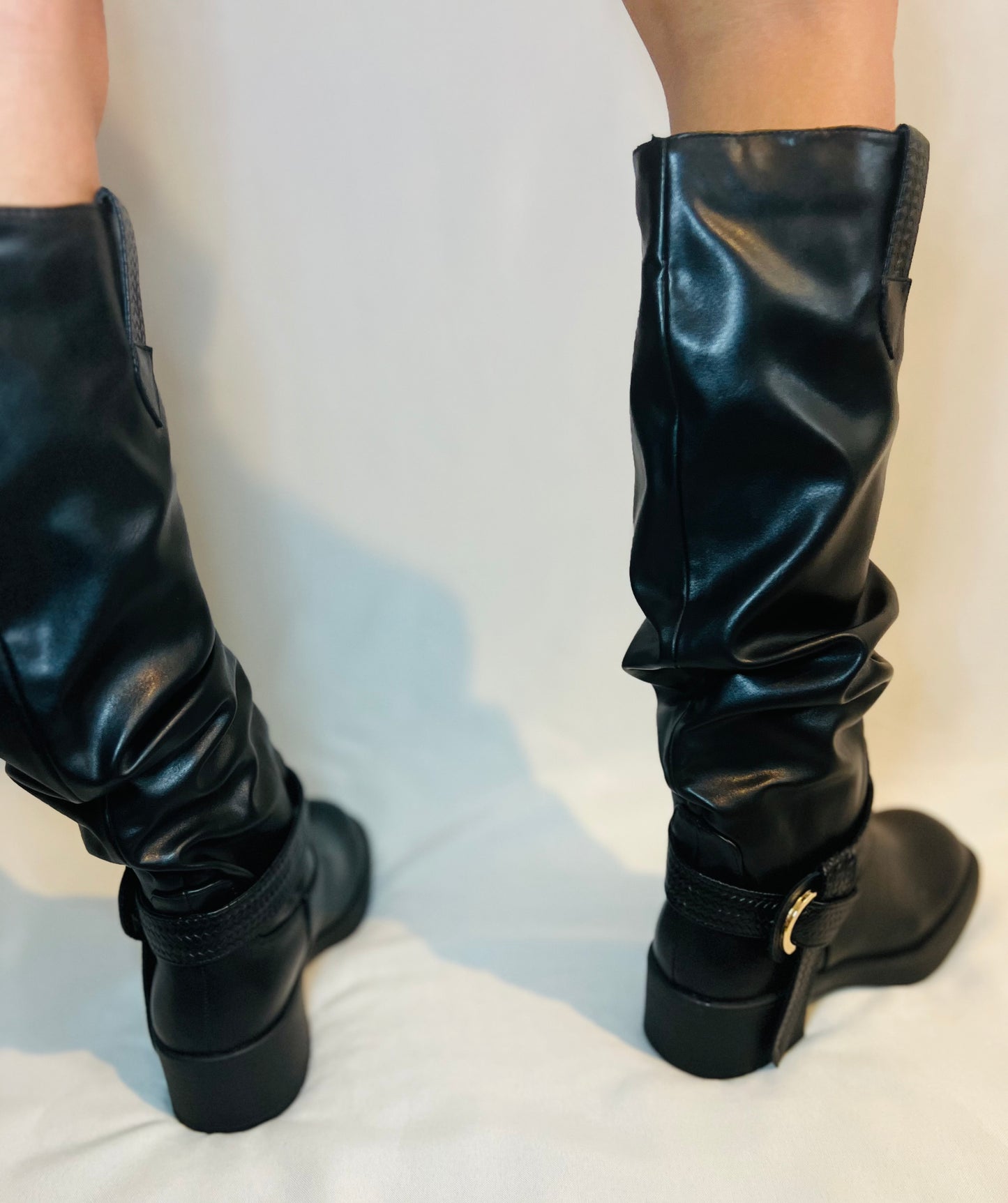 Black slouchy moto boots with chunky heel and edgy modern grunge streetwear styling