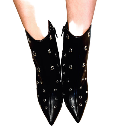 Black studded pointed toe ankle boots with edgy streetwear and modern grunge styling