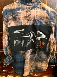 Oversized vintage plaid flannel jacket with custom Vans inspired graphic patch and distressed streetwear styling
