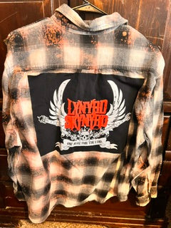 Oversized vintage plaid flannel jacket with custom Lynyrd Skynyrd inspired graphic patch and distressed streetwear styling