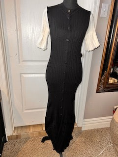  a black and cream modest knit maxi dress with minimalist elegant styling