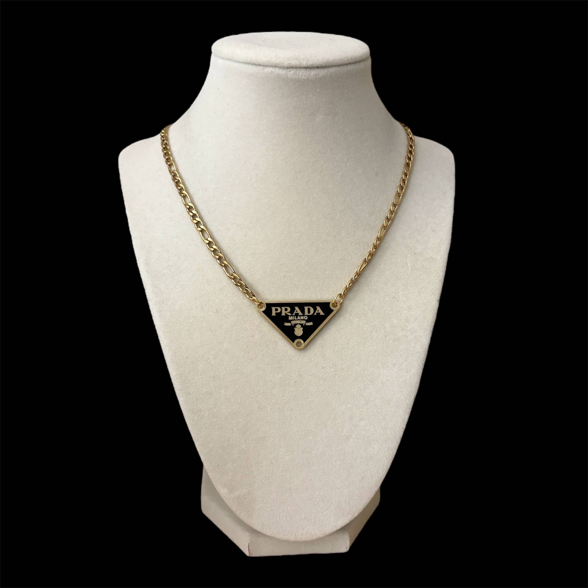 Repurposed luxury inspired triangle pendant necklace with gold chain and black enamel detail