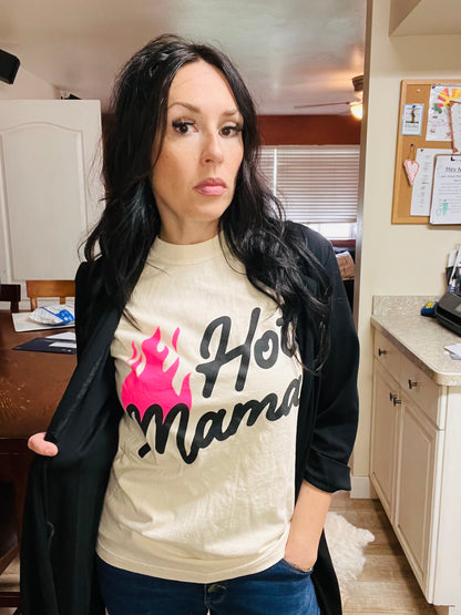 Woman wearing a t-shirt with 'Hot Mama' text in a kitchen setting