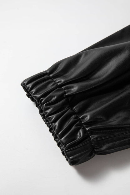Black pleated fabric on a white background