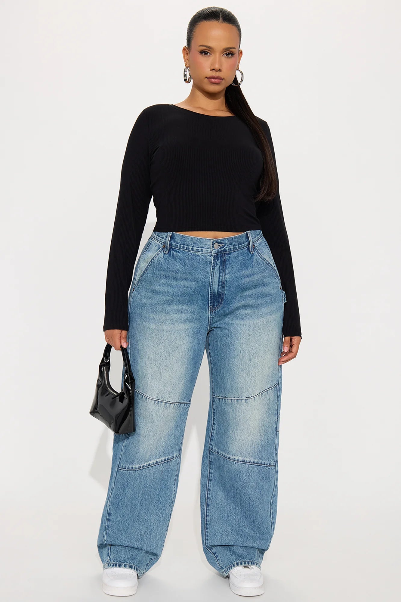 Light wash wide leg carpenter jeans with relaxed oversized streetwear styling