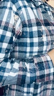Close-up of a blue and white checkered fabric with a focus on texture and pattern.