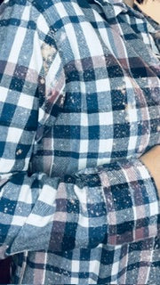 Close-up of a blue and white checkered fabric with a focus on texture and pattern.