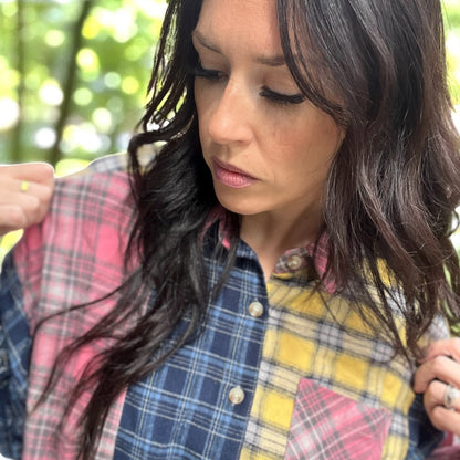 Oversized patchwork plaid flannel shirt styled with distressed denim jeans