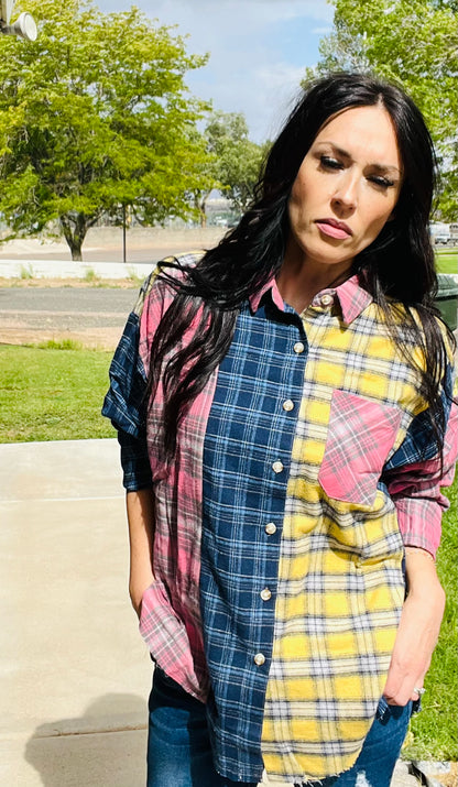 Oversized patchwork plaid flannel shirt styled with distressed denim jeans