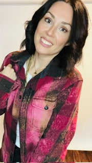 Woman wearing a patterned jacket indoors