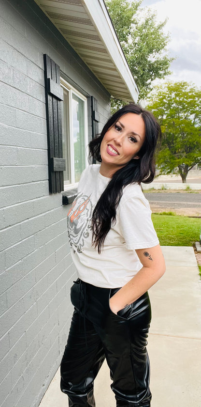 Woman standing outside a house with a gray exterior